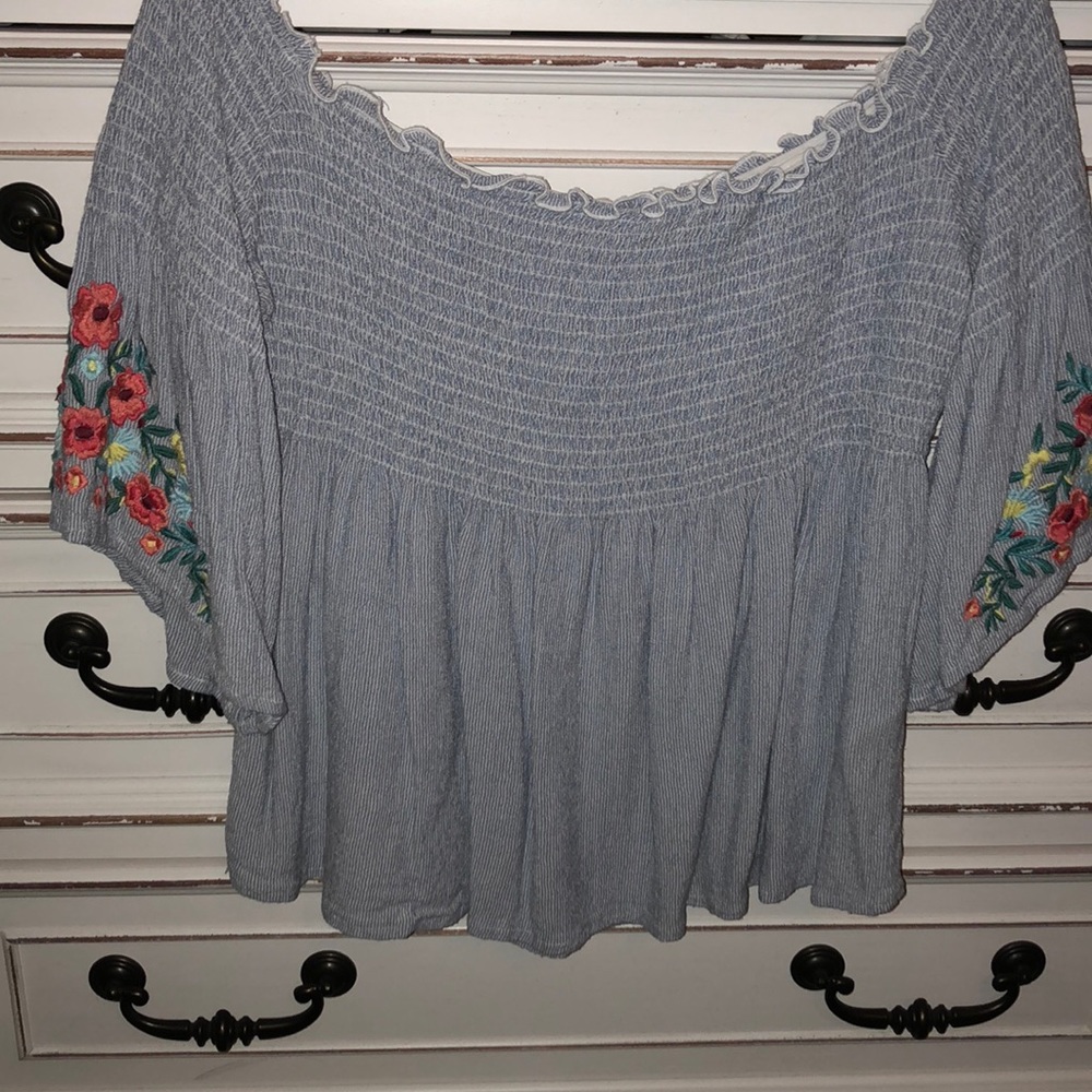 Off shoulder top with floral embroidered sleeves